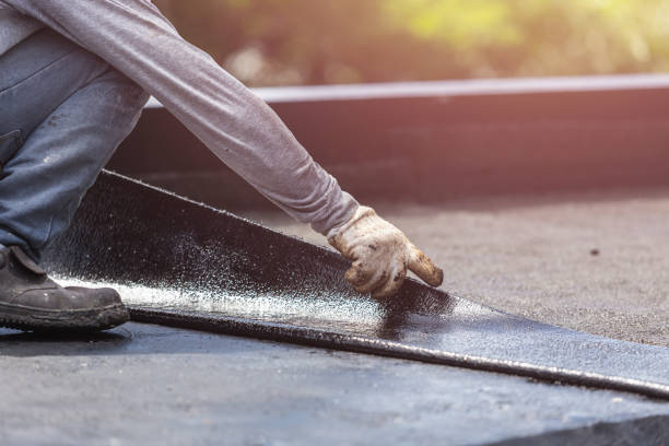Professional Exterior Waterproofing technician working in Haslett, MI